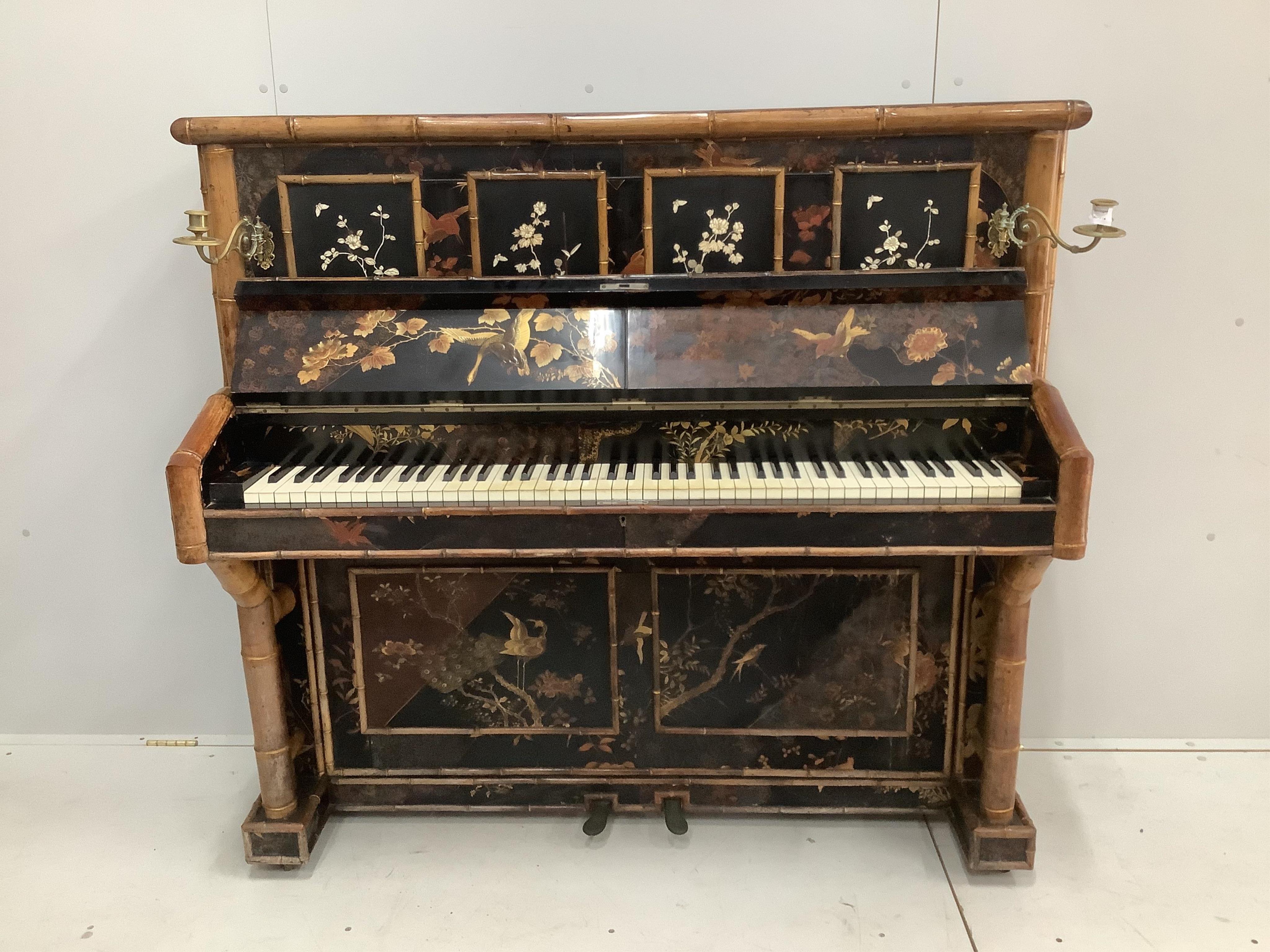 A late Victorian chinoiserie lacquer upright piano with bamboo effect decoration, width 142cm, height 129cm together with a matching stool. CITES Submission reference R2GP9JYE. Condition - fair